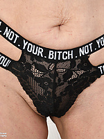 Mature milf solo tease with natural bush and dildo toy play on sofa spread pose