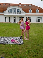 Naked outdoor threesome on picnic blanket with three women in spread pose