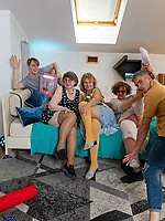 Mature women in colorful thigh-high tights pose together in group