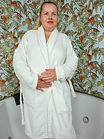 Mature nude woman solo tease with hairy pussy and sagging tits in wet bath