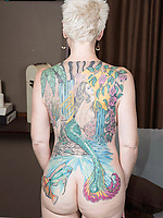 Tattooed mature milf nude tease with natural tits and big booty out