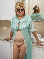 Blonde mature woman undresses and masturbates in bathroom
