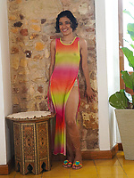 Young hairy brunette stripping rainbow dress showing bush