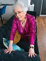 Mature granny teasing in hot pink satin dress and revealing lace panties