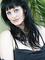 Mature brunette teasing in short gray dress and high heels