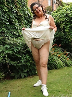 Mature bbw in tennis skirt teases outdoors lifting up her panties