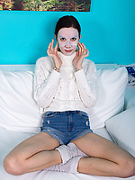 Tattooed babe in cozy sweater shows off hairy pussy and fingers deep