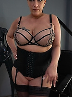 Mature cougar in corset and stockings with big tits, thick curves and solo finger tease