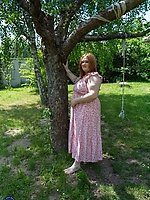 Mature redhead flaunts natural tits and big booty in raw outdoor spread tease