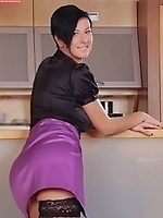 MILF in sexy office outfit shows off tight holes in kitchen