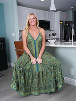 Blonde mature teases in kitchen before spreading wide on chair