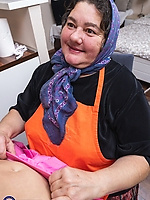 Mature granny with saggy tits and shaved pussy in raw spread pose