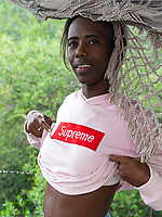 Skinny ebony babe strips outdoors and shows hairy pussy