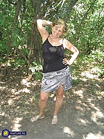 Busty mature flashing tits in forest sunlight