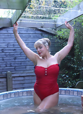 Mature porn pics starring appetizing blonde with big tits in the pool