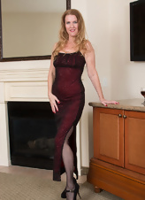 Slim wife takes off elegant dress and remains in stockings