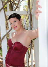 Outdoor photo session with mature taking red lingerie off