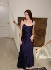 Pale-skinned redhead takes off elegant dress in solo pics