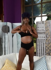 Black pregnant bitch with awesome forms poses in sex photos