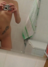 Nice red-haired mom takes nude selfies in the bathroom