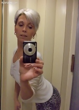 Elegant mature woman takes selfie-nude photos for her man