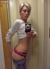 Elegant mature woman takes selfie-nude photos for her man