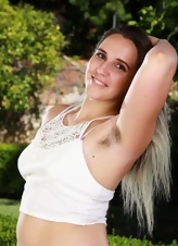 Joyful mom shows hairy armpits and pussy in outdoor pictures