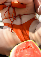 Watermelon makes classy MILF willing to show her jugs outdoors