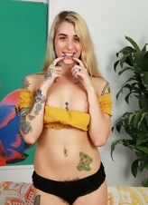 Blonde girl with tattoos wants everybody to check out hairy pussy