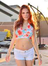 Solo pictures of svelte redhead flashing boobs under the sun