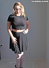Pretty blond BBW with glasses shows big juicy melons at work