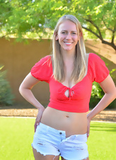 Cute blonde MILF in shorts shows saggy boobs in the backyard