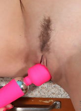 Masturbation gallery shows a cute brunette using a pink vibrator