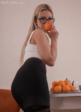 Glasses-wearing blonde cutie shows oranges and her twat too