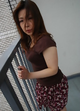 Teasing photos featuring a mature Asian woman with a nice round bottom