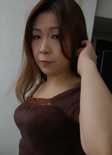 Teasing photos featuring a mature Asian woman with a nice round bottom