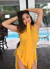 Sexy brunette in yellow dress toying outdoors MILF sex pics