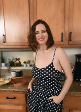 Naked milf in the kitchen bakes great buns and has time to fondle her natural tits