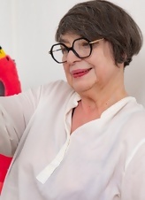 Trying on lingerie by an attractive granny with glasses