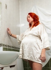 Naked redheaded pregnant masturbating in the bathroom