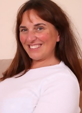Busty Milf Strips On Couch Gallery