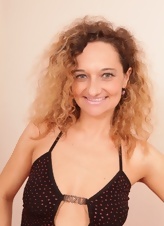 Curly Milf Striptease On Red Couch