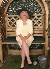 GILF Garden Tease In Yellow Dress Pics