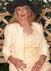 GILF Garden Tease In Yellow Dress Pics