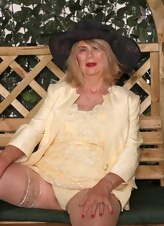 GILF Garden Tease In Yellow Dress Pics