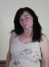 Older Brunette Strips And Teases