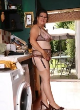 Mature Brunette In Lingerie Kitchen Strip Gallery