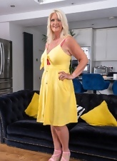 Mature Blonde Teasing Yellow Dress Photos