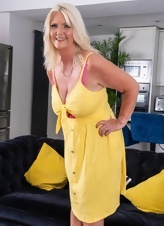 Mature Blonde Teasing Yellow Dress Photos
