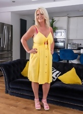 Mature Blonde Teasing Yellow Dress Photos